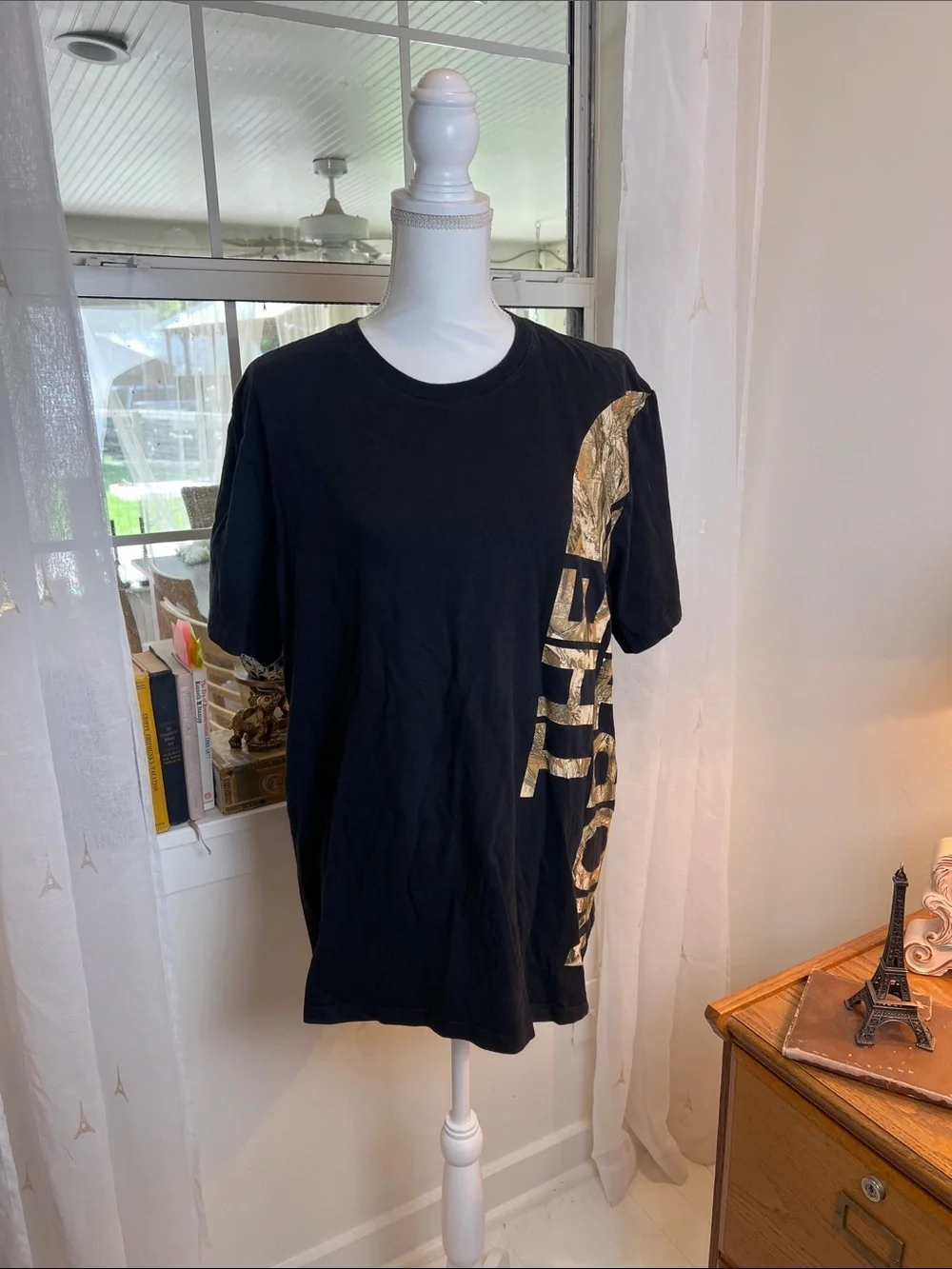The North Face Black Tee with Gold Side Logo size XL.